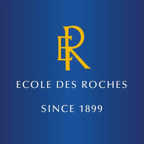 Ancien logo de l'École des Roches : Les lettres E et R entremêlées en jaune roi, le titre École des Roches en dessous, le texte Since 1899 en dessous